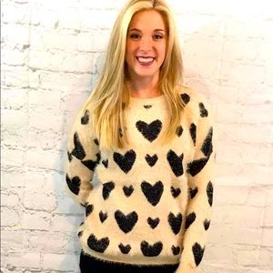 Furry heart sweater, very soft. Brand new never worn it is from my boutique.
